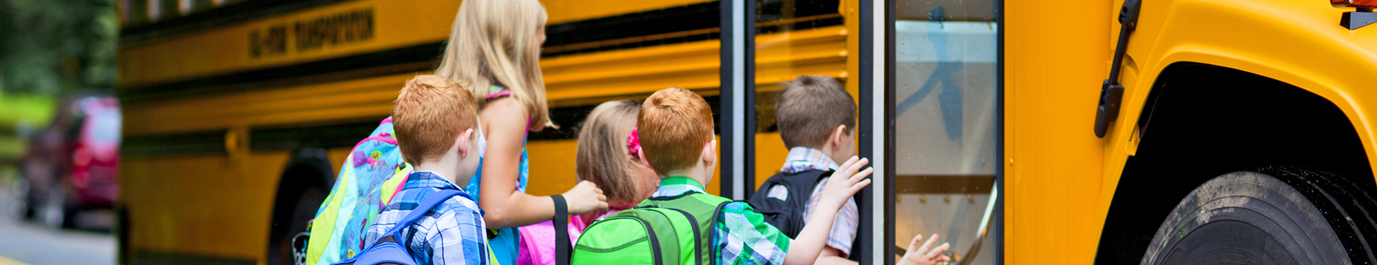 Children getting on schoolbus