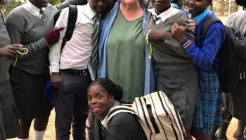 photo of Dr. Ritter and students in Zimbabwe