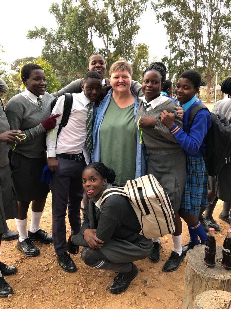 photo of Dr. Ritter and students in Zimbabwe